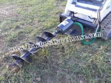 skid steer with new cid extreme auger|cid rock auger.